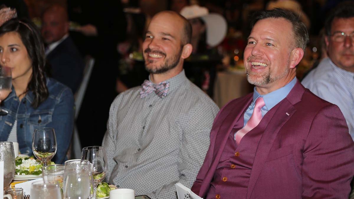 Image of Tim Gebhart and Sean Casey sitting at a Gala table.