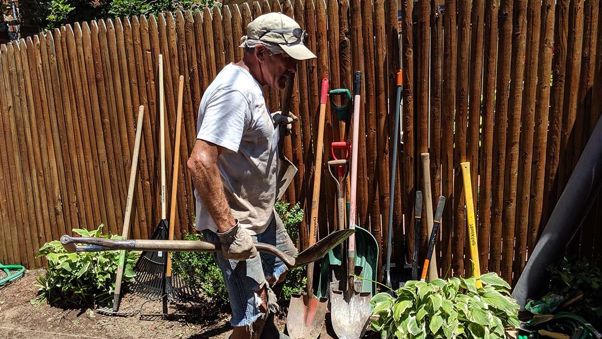 Image of volunteer working in a garden.