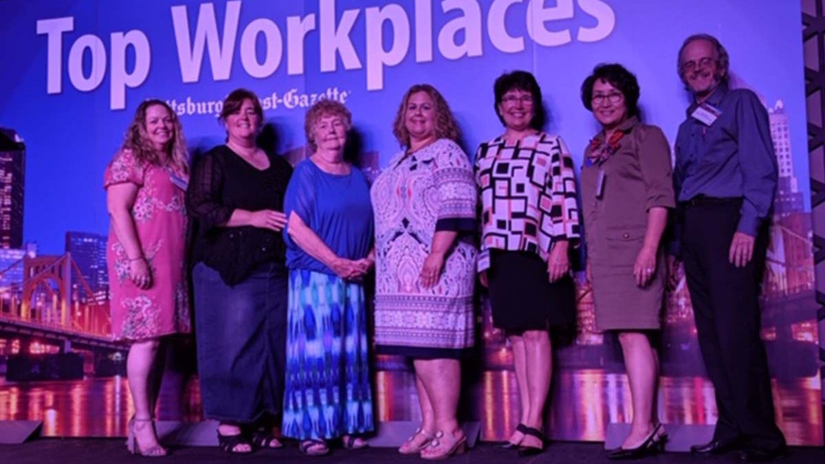 Image of Emmaus employees at the Top Workplace award ceremony.