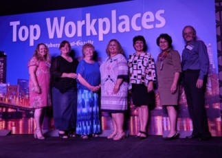 Image of Emmaus employees at the Top Workplace award ceremony.