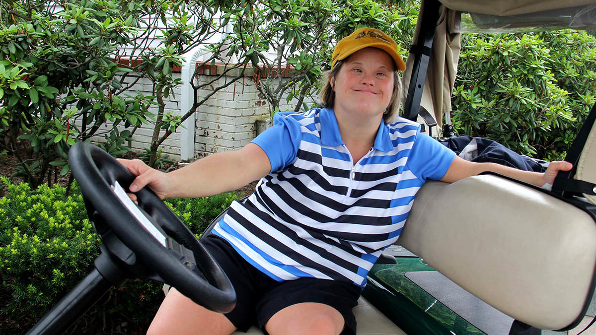Image of disabled girl on golf cart