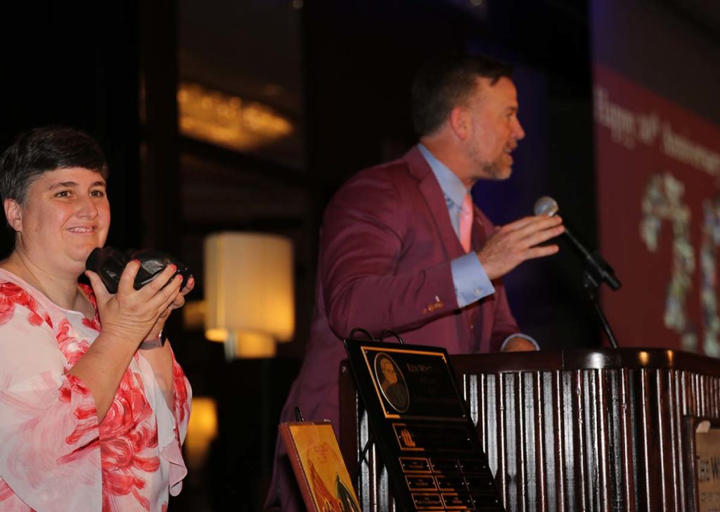 Image of Cece Wagner clapping as Sean casey accepts award.